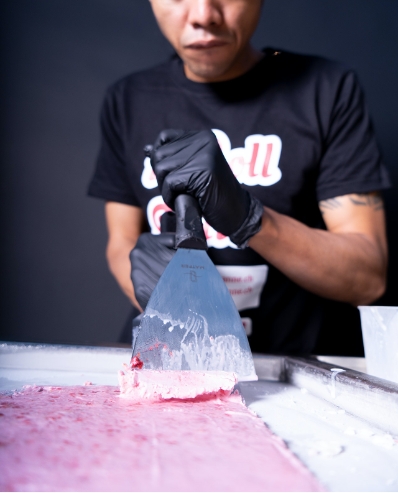 Scrape the griddle with the spatulas
